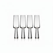 Set of four clear glass flutes on a white background