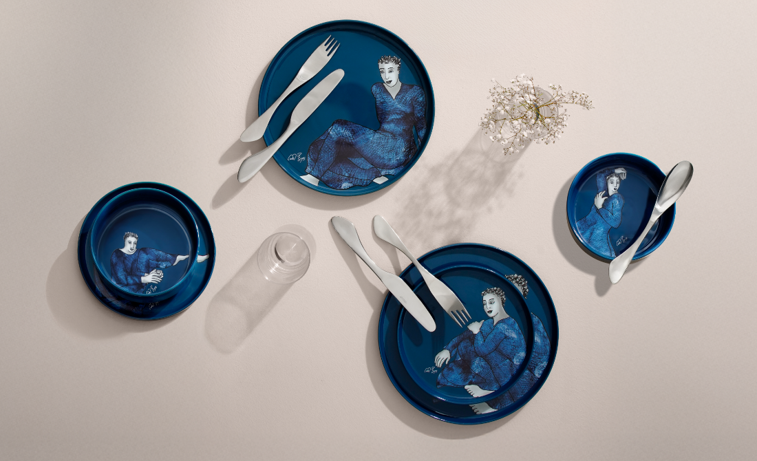 Stylish office accessories a metal pen holder with face design and a clock, with a blue and teal background.