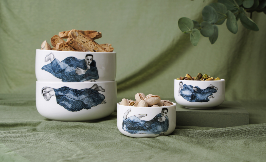 Elegant table setting with white ceramic bowl and plate featuring indigo girl designs