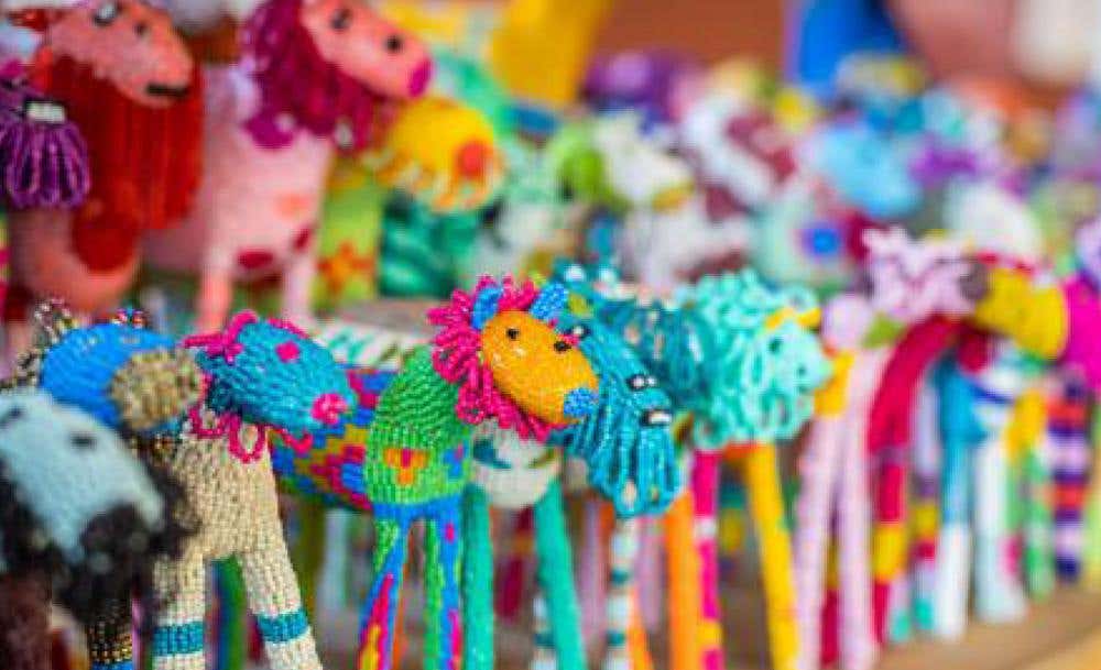 MonkeyBiz banner showcasing beaded art pieces